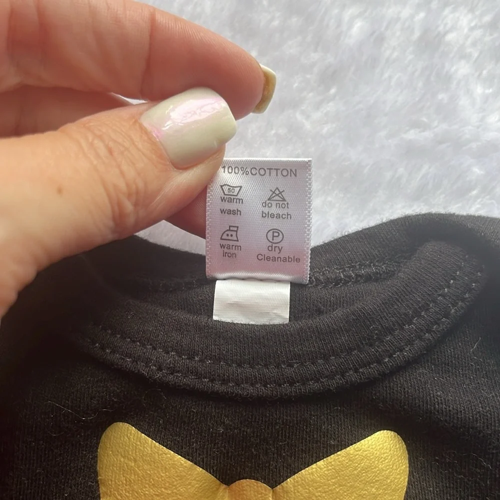 Black baby gown with gold heart and‎ bow detail